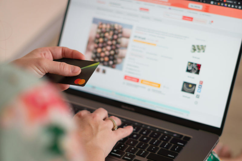 Woman shopping online with laptop